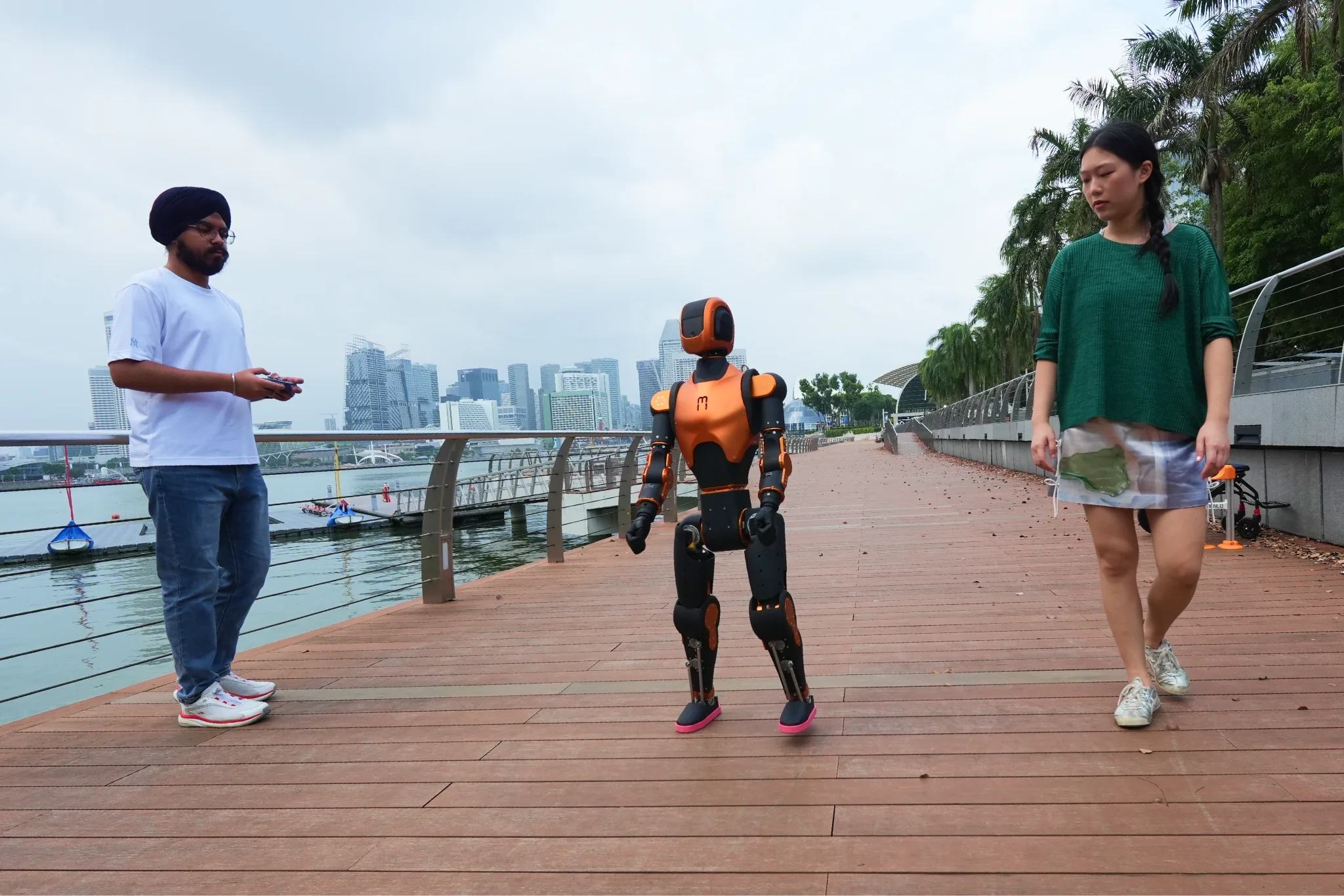 Ishneet and Ariel walking Asimov along Marina Bay Sands